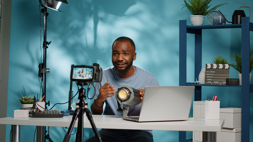 Conquer the Digital Landscape: Top 6 Marketing Trends for 2024 2 african american blogger reviewing studio light camera | First Impact